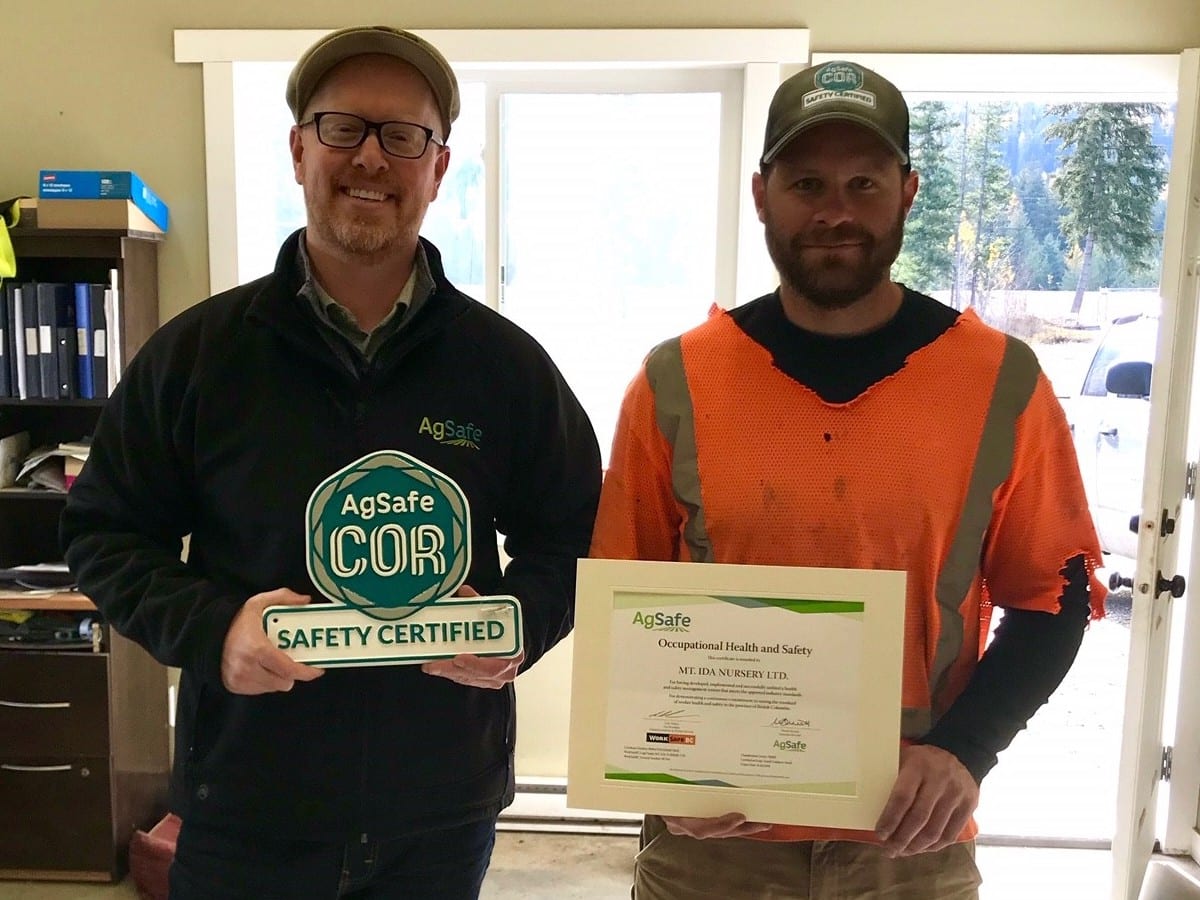 Image of us recieving our COR certificate for our commitment to safesty as a tree nursery.